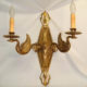 Two-armed cast brass wall sconce with bird motif