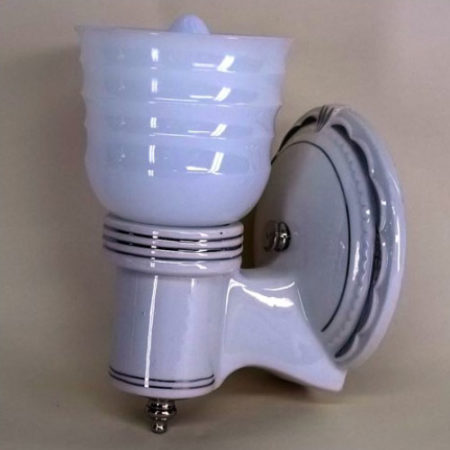 Single white porcelain wall sconce with silver accents