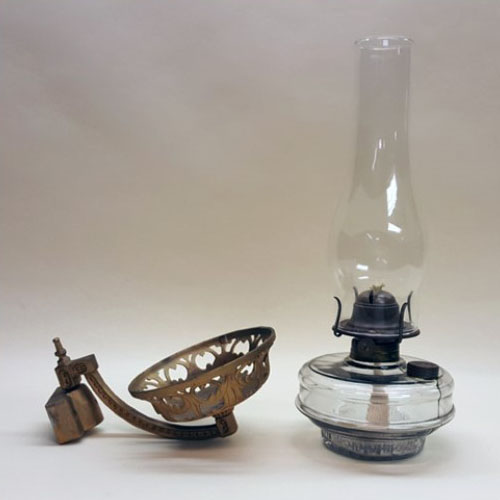 Kerosene lamp with cast iron wall bracket