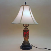 Unusual table lamp with wind-up music box in base