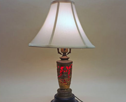 Unusual table lamp with wind-up music box in base