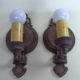 Pair of single-armed cast iron wall sconces