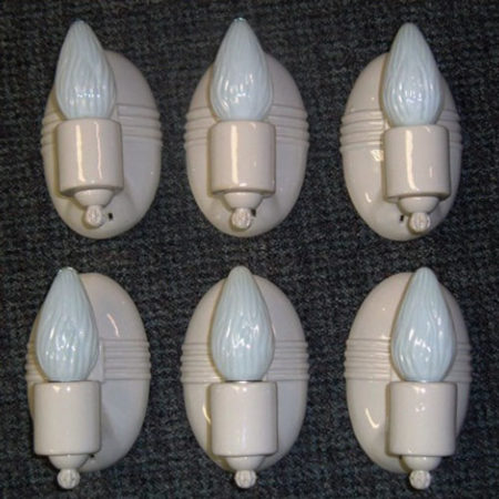 Six matching oval porcelain wall sconces