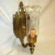 Single brass wall sconce signed Miller Co.