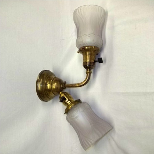 Double-armed wall sconce, signed Bradley & Hubbard