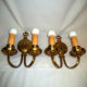 Pair of double-armed brass wall sconces