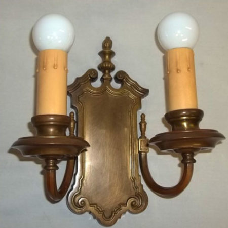 Double-armed cast brass wall sconce
