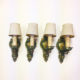 four matching polychrome wall sconces