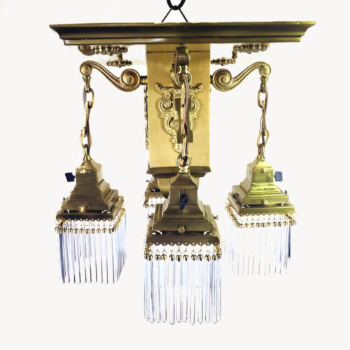 Mission style brass chandelier with four lights