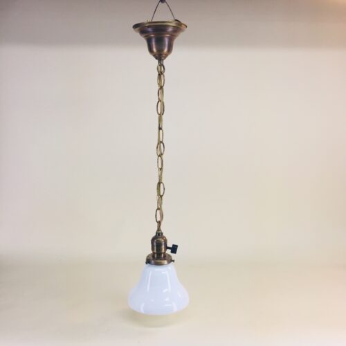 Brass pendant with white opal glass bell shade