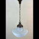 Brass pendant with large glass school globe